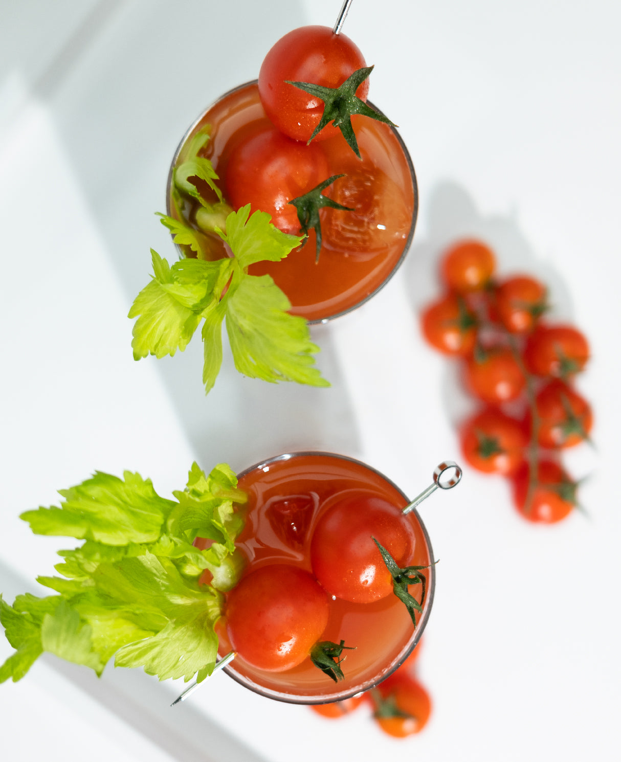Bloody Mary cocktails with cherry tomatoes. 