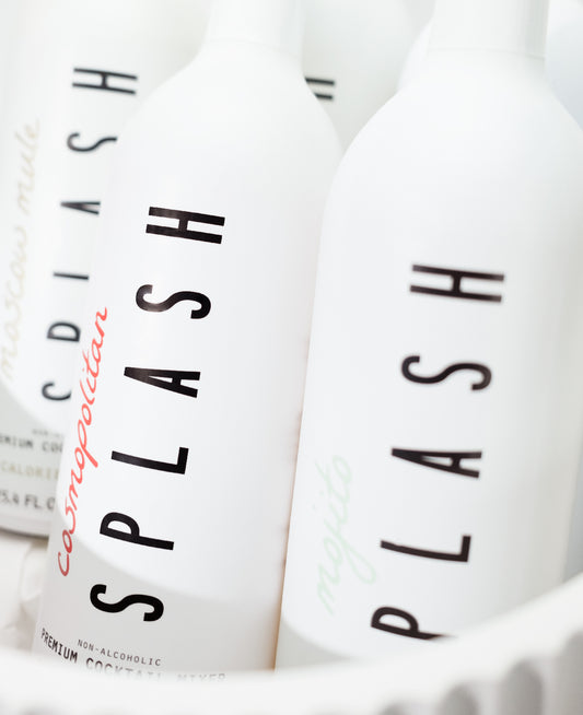 Close up shot of Splash Mixer bottles in a ceramic ice bucket.